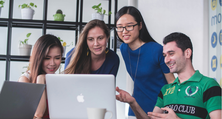 four coworkers collaborating together